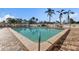 Beautiful community pool area with lounge chairs and lush tropical landscaping at 2901 26Th W St # 204, Bradenton, FL 34205