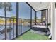 A cozy screened patio with views of the parking lot, and turf-covered floors at 2901 26Th W St # 204, Bradenton, FL 34205