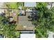 Birds-eye view of the home with a fenced-in backyard and lush trees, showcasing its setting at 3307 Miami Pl, Bradenton, FL 34207
