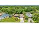 Attractive property with well-maintained landscaping, mature trees, and inviting curb appeal at 3525 Riviera Dr, Sarasota, FL 34232