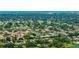 Serene neighborhood setting with tree-lined streets and close proximity to shopping and restaurants at 3525 Riviera Dr, Sarasota, FL 34232