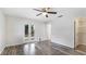 This bedroom features wood-look floors and direct patio access at 3525 Riviera Dr, Sarasota, FL 34232