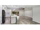 Well-designed kitchen with stainless steel appliances, a sleek island, and a convenient layout at 3525 Riviera Dr, Sarasota, FL 34232