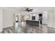 Open-concept living space with stylish flooring, modern fixtures, and abundant natural light at 3525 Riviera Dr, Sarasota, FL 34232