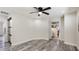 Spacious main bedroom features wood-look flooring and a ceiling fan at 3525 Riviera Dr, Sarasota, FL 34232