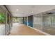 Bright, open sunroom with large windows and access to backyard; ideal for indoor-outdoor living at 3525 Riviera Dr, Sarasota, FL 34232