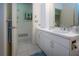 Bright bathroom with a large white vanity and tile flooring at 3615 Puerta Ct # 8516, Sarasota, FL 34232