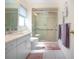 Well-lit bathroom with a glass-enclosed shower and modern vanity at 3615 Puerta Ct # 8516, Sarasota, FL 34232