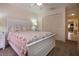 Bright bedroom featuring a closet and neutral decor with a floral patterned comforter at 3615 Puerta Ct # 8516, Sarasota, FL 34232