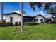 Charming single-story home with lush green lawn and mature landscaping offers a serene setting at 3615 Puerta Ct # 8516, Sarasota, FL 34232