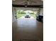 Garage view with epoxy flooring and a car parked inside the garage at 3615 Puerta Ct # 8516, Sarasota, FL 34232
