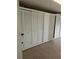 Garage with white cabinets and epoxy flooring that provides extra storage at 3615 Puerta Ct # 8516, Sarasota, FL 34232