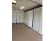 Spacious garage with epoxy flooring and white cabinets provides ample storage space at 3615 Puerta Ct # 8516, Sarasota, FL 34232