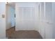 Hallway featuring a series of large closets with ample storage space at 3615 Puerta Ct # 8516, Sarasota, FL 34232