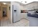 Bright kitchen with white cabinets, appliances and dark countertops at 3615 Puerta Ct # 8516, Sarasota, FL 34232