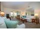 Bright living room featuring neutral tones, vaulted ceilings, and comfortable seating at 3615 Puerta Ct # 8516, Sarasota, FL 34232
