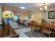 Open concept living and dining area with vaulted ceilings and an abundance of natural light at 3615 Puerta Ct # 8516, Sarasota, FL 34232