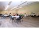 Spacious recreation room with multiple tables and chairs, ideal for community gatherings at 3615 Puerta Ct # 8516, Sarasota, FL 34232