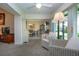 Inviting sunroom with natural light, wicker seating, and easy access to the outdoor patio at 3615 Puerta Ct # 8516, Sarasota, FL 34232