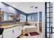 Bathroom featuring a soaking tub, single vanity, and neutral color scheme at 3636 Torrey Pines Blvd, Sarasota, FL 34238