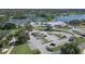 Aerial view of tennis courts, a swimming pool, parking, and a community building at 3636 Torrey Pines Blvd, Sarasota, FL 34238
