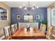 A well-lit dining room featuring hardwood floors and elegant decor, perfect for Gathering gatherings and dinner parties at 3636 Torrey Pines Blvd, Sarasota, FL 34238