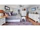 Bright main bedroom with a king bed, hardwood floors, and a ceiling fan for added comfort at 3636 Torrey Pines Blvd, Sarasota, FL 34238