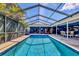 Inviting screened pool with clear blue water and an expansive patio area at 3636 Torrey Pines Blvd, Sarasota, FL 34238