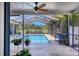 Enclosed swimming pool with blue water and outdoor patio with open views at 3636 Torrey Pines Blvd, Sarasota, FL 34238