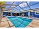 Sparkling screened-in pool with plenty of room for seating and dining on the patio at 3636 Torrey Pines Blvd, Sarasota, FL 34238