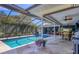 Relaxing screened pool with a covered patio area, ideal for outdoor entertaining at 3636 Torrey Pines Blvd, Sarasota, FL 34238