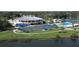 A vibrant sports complex featuring tennis courts, a clubhouse, and a refreshing pool for active community living at 3636 Torrey Pines Blvd, Sarasota, FL 34238