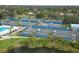 An aerial view displays the community tennis courts available to the residents of this lush neighborhood at 3636 Torrey Pines Blvd, Sarasota, FL 34238