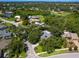 Aerial view of a property nestled among trees, showcasing its private setting within a lush neighborhood at 3900 Country View Dr, Sarasota, FL 34233