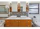 Bright bathroom features a double vanity and modern fixtures at 3900 Country View Dr, Sarasota, FL 34233