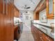Convenient laundry area with modern appliances and custom wood cabinets for ample storage and organization at 3900 Country View Dr, Sarasota, FL 34233