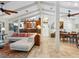 Open living and dining area features tile floors, vaulted ceilings, and a cohesive design at 3900 Country View Dr, Sarasota, FL 34233