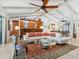 Spacious living room area with tile flooring, comfortable seating, and an open concept design at 3900 Country View Dr, Sarasota, FL 34233