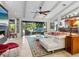 Open concept living room features a fireplace, high ceilings, and lots of seating at 3900 Country View Dr, Sarasota, FL 34233