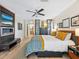 Spacious primary bedroom with sleek decor and a calming atmosphere, with access to the ensuite bath at 3900 Country View Dr, Sarasota, FL 34233