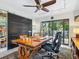 Office featuring a large wood desk, an ergonomic chair, an area rug, and sliding glass doors at 3900 Country View Dr, Sarasota, FL 34233