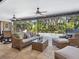 This lanai includes an outdoor seating area with a view of the pool and greenery at 3900 Country View Dr, Sarasota, FL 34233