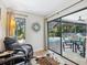 Relaxing sitting area with comfortable chairs and view to the pool area at 3900 Country View Dr, Sarasota, FL 34233