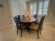 Formal dining room with an oval wood table and six upholstered chairs at 4428 Conchfish Ln, Osprey, FL 34229