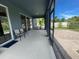 Screened in patio with access to a sunny, fully fenced backyard with brick patio and mature landscaping at 4428 Conchfish Ln, Osprey, FL 34229