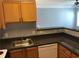 Well-equipped kitchen features stainless steel sink, wood cabinets, and laminate counters at 4802 51St W St # 1313, Bradenton, FL 34210