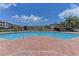 Community pool with ample seating and lush landscaping at 4802 51St W St # 1313, Bradenton, FL 34210