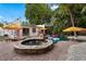 Relaxing backyard oasis with a built-in spa, in-ground pool, and lush tropical landscaping at 522 31St W St, Bradenton, FL 34205