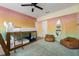 A colorful bedroom has bunkbeds, two brown leather beanbag chairs, and an unusual oblong mirror at 522 31St W St, Bradenton, FL 34205