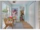 Charming dining area with light blue walls, wicker chairs, and lots of natural light at 522 31St W St, Bradenton, FL 34205